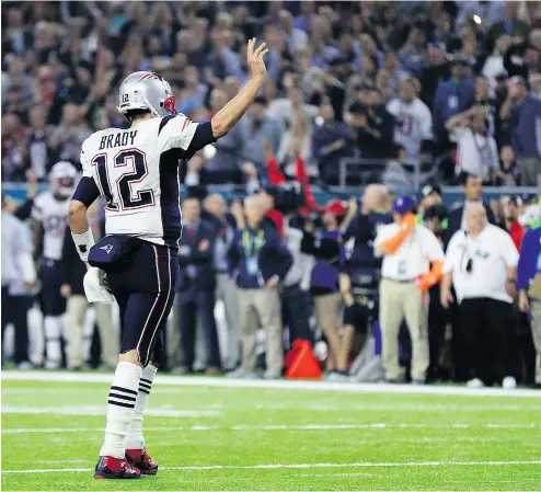  ?? MIKE EHRMANN / GETTY IMAGES ?? Tom Brady reacts to the crowd at Super Bowl 51 against the Atlanta Falcons in Houston Sunday. New England emerged 31-28 winners after the Falcons roared to a 21-point first-half lead and a 25-point edge midway through the third quarter.