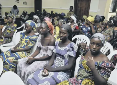  ??  ?? Chibok schoolgirl­s freed at the weekend from Boko Haram captivity in Abuja, Nigeria, yesterday.