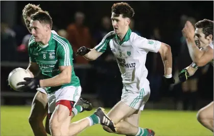  ??  ?? Brendan Travers on the move for Naomh Eanna with Oisín Foley of Crossabeg-Ballymurn on his heels.