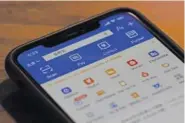  ?? AP FILE PHOTO/ NG HAN GUAN ?? The app for Alipay, the mobile payments service operated by Ant Group, is seen on a smartphone in Beijing.