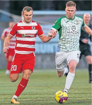  ?? ?? East Fife’s Aaron Steele (right) is closely marked by Bonnyrigg Rose defender Kevin Smith