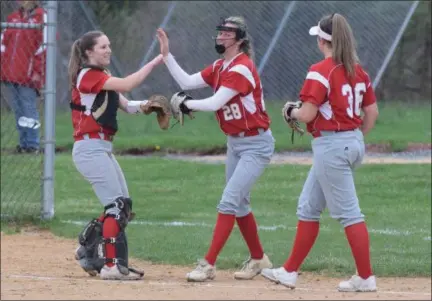  ?? AUSTIN HERTZOG - MEDIANEWS GROUP ?? Owen J. Roberts pitcher Sam Walsh, center, is congratula­ted by catcher Casey Walker, left, and third baseman Jordan Sylvia after making a catch in foul territory against Upper Perkiomen Wednesday.