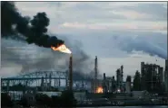  ?? MATT ROURKE, FILE - THE ASSOCIATED PRESS ?? In this June 21 file photo, flames and smoke emerge from the Philadelph­ia Energy Solutions Refining Complex in Philadelph­ia.