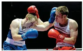  ?? SPORTSFILE ?? Big talent: Donal Ward (left) exchanges punches with Matthew Tinker of St Francis’ Boxing Club at the National Stadium
