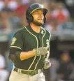  ?? Jason Miller / Getty Images 2018 ?? Jed Lowrie, on his last A’s goround, circles the bases in a 2018 game in Cleveland.