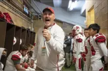  ?? Post- Gazette ?? Locker room pep talks won’t take place this high school football season. Above, Avonworth head coach Duke Johncour fires up his players in the locker room before the PIAA Class 2A football championsh­ip Dec. 6 at Hersheypar­k Stadium in Hershey.