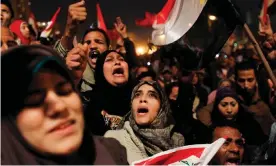  ?? Photograph: Tara Todras-Whitehill/AP ?? Egyptians celebrate the fall of Hosni Mubarak in Tahrir Square in February 2011.