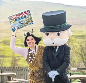  ?? ?? GAME FOR A VISIT: Lisa Bowerman aka Cavewomen, celebrates with Mr Monopoly after finding out that Stump Cross Caverns is one of the lucky Yorkshire businesses to appear on this special Yorkshire Dales Edition.