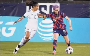  ?? Jessica Hill / Associated Press ?? The United States’ Megan Rapinoe controls the ball as Mexico’s Bianca Sierra defends during an internatio­nal friendly soccer match Thursday in East Hartford.