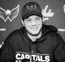  ?? ALEX BRANDON THE ASSOCIATED PRESS ?? Washington Capitals’ John Carlson reacts during a media availabili­ty at the National Hockey League team’s practice facility Monday in Arlington, Va. The Capitals have re-signed their star defenceman.