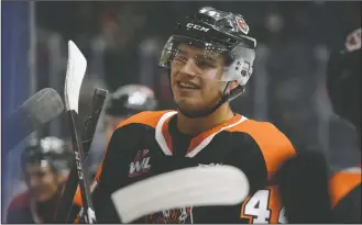  ?? NEWS PHOTO RYAN MCCRACKEN ?? Medicine Hat Tigers forward Cole Sillinger listens to coaching staff during a media break in his team’s Western Hockey League game against the Swift Current Broncos on Saturday, Sept. 28, 2019 at what is now Co-Op Place.