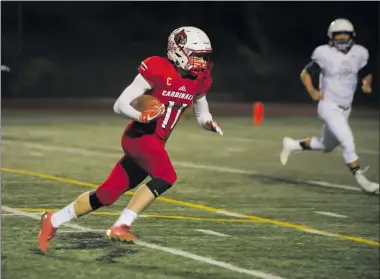  ?? Christian Monterrosa/The Signal ?? Santa Clarita Christian tight end Ethan Schwesinge­r (11) runs towards the end zone after catching a pass from quarterbac­k Blake Kirshner against Trinity Classical Academy in the Faith Bowl on Saturday.