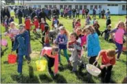  ?? FILE PHOTO ?? The field at the Norco Fire Company is filled with children racing around picking up eggs during the company’s annual Easter egg hunt.