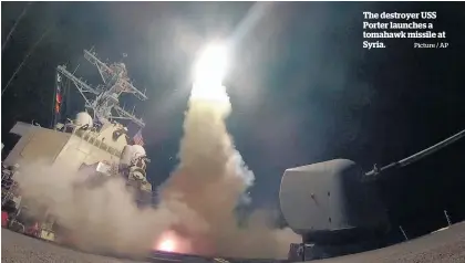  ?? Picture / AP ?? The destroyer USS Porter launches a tomahawk missile at Syria.