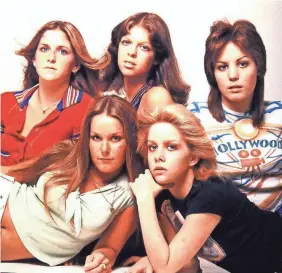  ?? GAB ARCHIVE/REDFERNS ?? Joan Jett started with The Runaways at age 15. Clockwise from back left, Sandy West, Jackie Fox, Joan Jett, Cheri Currie and Lita Ford.