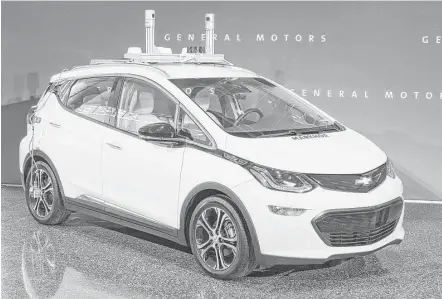  ?? General Motors ?? A General Motors self-driving car is displayed. GM is trying to persuade state lawmakers across the country to pass legislatio­n that would clear the way for it to make self-driving cars publicly available while potentiall­y limiting GM’s rivals.