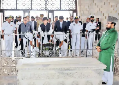  ?? APP ?? Prime Minister Imran Khan laying a floral wreath at the grave of Quaid-e-azam Mohammed ali jinnah in Karachi on sunday. —