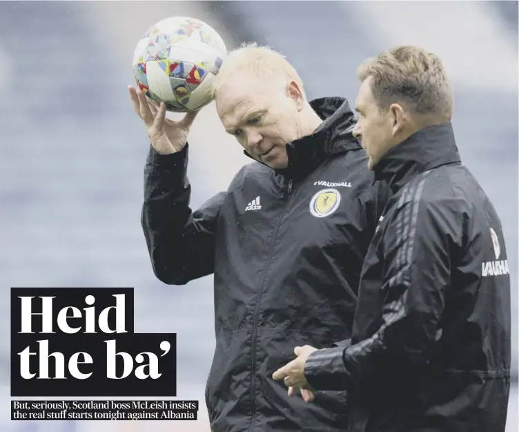  ??  ?? 0 Scotland manager Alex Mcleish and his assistant Peter Grant are deep in thought during a training session at Hampden Park ahead of tonight’s Nations League match against Albania. Preview, pages 2-5
