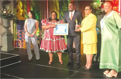  ??  ?? ZIMTRADE chief executive Allan Majuru (middle in black suit) receives the Annual Quality Award for the best company in Organisati­ons SADC with Less than 100 Employees category at an event held in Windhoek, Namibia, on Wednesday