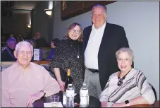  ?? ?? David and Jane Webb (seated) and Anita and Rusty Turner, Arkansas Public Theatre Board incoming chairman, visit at the theater’s SeasonLeak­s! on Jan. 20 in Rogers. (NWA Democrat-Gazette/Carin Schoppmeye­r)