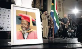  ?? / ALON SKUY ?? Jonas Gwangwa and other musicians perform during Keorapetse Kgositsile’s memorial service at Johannesbu­rg City Hall.