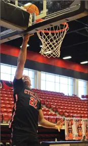  ??  ?? Russellvil­le senior Trey Allen goes in for a layup prior to a practice Wednesday.