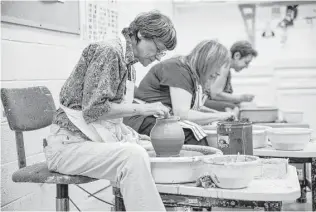  ?? Michael Ciaglo / Houston Chronicle ?? A pottery class is held at Houston’s Jewish Community Center. The center could be one of the first buildings in the city to take advantage of the Property Assessed Clean Energy program.