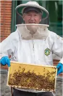  ?? JEFF RHODE/HOLY NAME ?? Rod Donovan set up beehive boxes on the roof of Holy Name Medical Center in New Jersey.