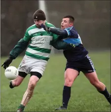  ??  ?? Brendan Whelan of Ballymanus gets his shot away despite the attentions of An Tochar’s Conor McKenna.