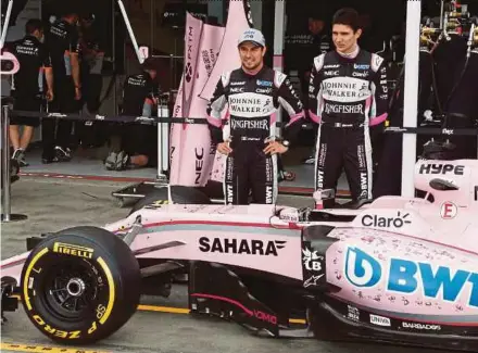  ??  ?? Force India’s Sergio Perez (left) and teammate Esteban Ocon before the opening practice sessions of the Australian Grand Prix in Melbourne yesterday.