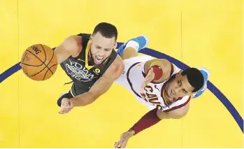  ?? EZRA SHAW/THE ASSOCIATED PRESS ?? Golden State point guard Stephen Curry drives for a layup against Cleveland Cavaliers counterpar­t Jordan Clarkson during Game 2 of the NBA Finals on Sunday. The Warriors won 122-103.