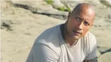  ?? Courtesy New Line Cinema ?? Dwayne “The Rock” Johnson is teaming up with Siri.