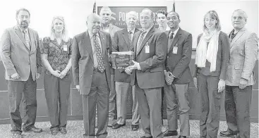  ?? Port Freeport ?? Port Freeport recently presented Shintech a “Partners in Environmen­tal Stewardshi­p Award.” From left, are Mike Wilson, of Port Freeport; Melanie Oldham, an environmen­tal advocate; Ravi Singhania, chairman of Port Freeport; Paul Kresta and Bill Terry,...