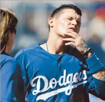  ?? Lenny Ignelzi Associated Press ?? JUSTIN SELLERS, shown after being hit by a ball in a recent game, batted only .203 (25 for 123) with nine doubles, one home run and 13 runs batted in in 2782⁄ innings with the Dodgers last season.