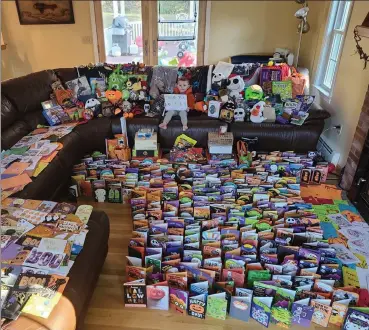  ?? Courtesy of meaghan luther ?? adam luther, holding a ‘thank you so much’ sign, received hundreds of cards and packages from around the world after his mother, meaghan, posted on facebook asking well-wishers to send cards for adam’s brain surgery.