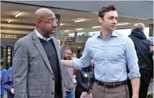  ?? NATRICE MILLER/ATLANTA JOURNAL-CONSTITUTI­ON ?? Sen. Raphael Warnock, left, chats with Sen. Jon Ossoff during a 2022 campaign rally at the UPS Smart Hub facility in Atlanta.