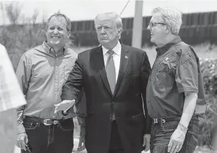  ?? Jerry Lara / Staff photograph­er ?? Former President Donald Trump appeared with Attorney General Ken Paxton, left, and Lt. Gov. Dan Patrick during a visit to the border wall June 30 in Pharr. Trump will be in Dallas on Sunday.