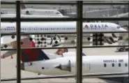  ?? AP FILE PHOTO ?? In this Monday, Aug. 8, 2016, file photo, Delta Air Lines planes are parked at Ronald Reagan Washington National Airport, in Washington.