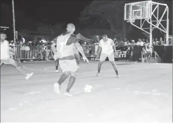  ??  ?? Profitt (no.7) of Leopold Street initiating an attacking play while being watched closely by Carl Tudor (right) of North East La Penitence in the 7th Guinness ‘Greatest of the Streets’ Georgetown Zone at the Burnham Court.