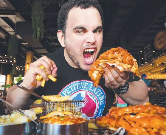  ??  ?? Arundel local Chadwick Jones has a huge appetite for success in competitiv­e eating.