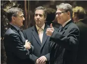  ?? DREW ANGERER/GETTY IMAGES ?? Michael Cohen of the Trump Organizati­on, centre, with retired Lt. Gen. Michael Flynn, left, and former Texas governor Rick Perry at Trump Tower in December.