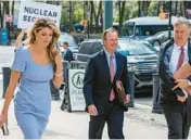  ?? BRITTAINY NEWMAN/AP ?? Former President Donald Trump’s attorneys Lindsey Halligan, left, Chris Kise and James Trusty arrive Tuesday at Brooklyn Federal Court in New York City.