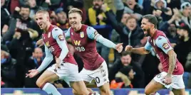  ??  ?? Aston Villa’s Jack Grealish (centre) celebrates with teammates after scoring against Newcastle on Monday