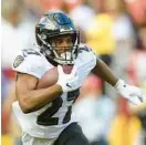  ?? NICK WASS/AP ?? J.K. Dobbins, who led NFL running backs in yards per carry as a rookie in 2020, missed all of last season after tearing his left ACL in the Ravens’ preseason finale.