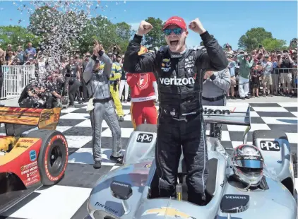  ?? MARK HOFFMAN / MILWAUKEE JOURNAL SENTINEL ?? Josef Newgarden celebrates his win in Victory Lane on Sunday at the the Verizon IndyCar Series Kohler Grand Prix at Road America in Elkhart Lake. Newgarden won the race from pole.
