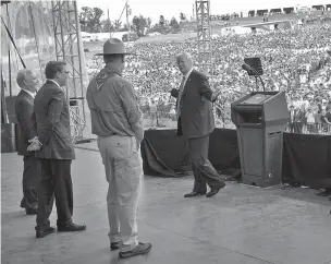  ??  ?? From left, Secretary of Health and Human Services Tom Price, Energy Secretary Rick Perry and Interior Secretary Ryan Zinke stand by as President Donald Trump on Monday addresses the Boy Scouts of America’s 2017 National Scout Jamboree at the Summit...