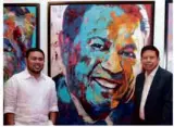  ??  ?? DPWH Secretary Mark Villar (at left) and Engr. Conrado P. Acedillo Sr. with the portrait painting of his father, Mr. Manny Villar.