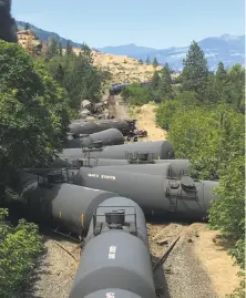  ?? Silas Bleakley / Associated Press ?? Tanker train accidents like this near Mosier, Ore., in June have raised concerns around the country about oil transporta­tion.