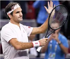  ??  ?? Roger Federer celebrates after winning against Roberto Bautista Agut during their men’s singles third round match at the Shanghai Masters tennis tournament. — AFP photo