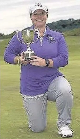 ??  ?? Lydia Hall with the Welsh National PGA Championsh­ip trophy she won last week at Tenby